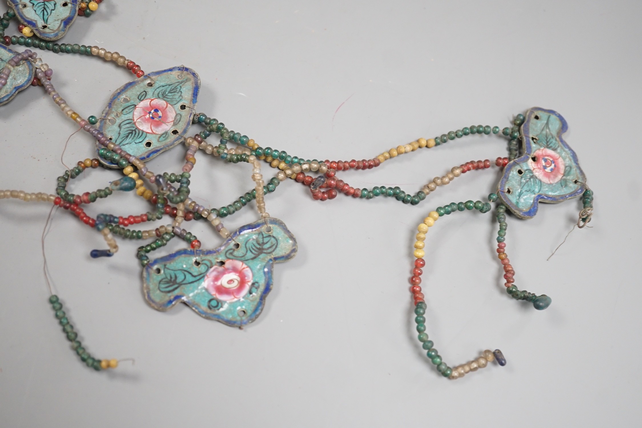 A group of Chinese enamel and glass bead hanging decorations, early 20th century